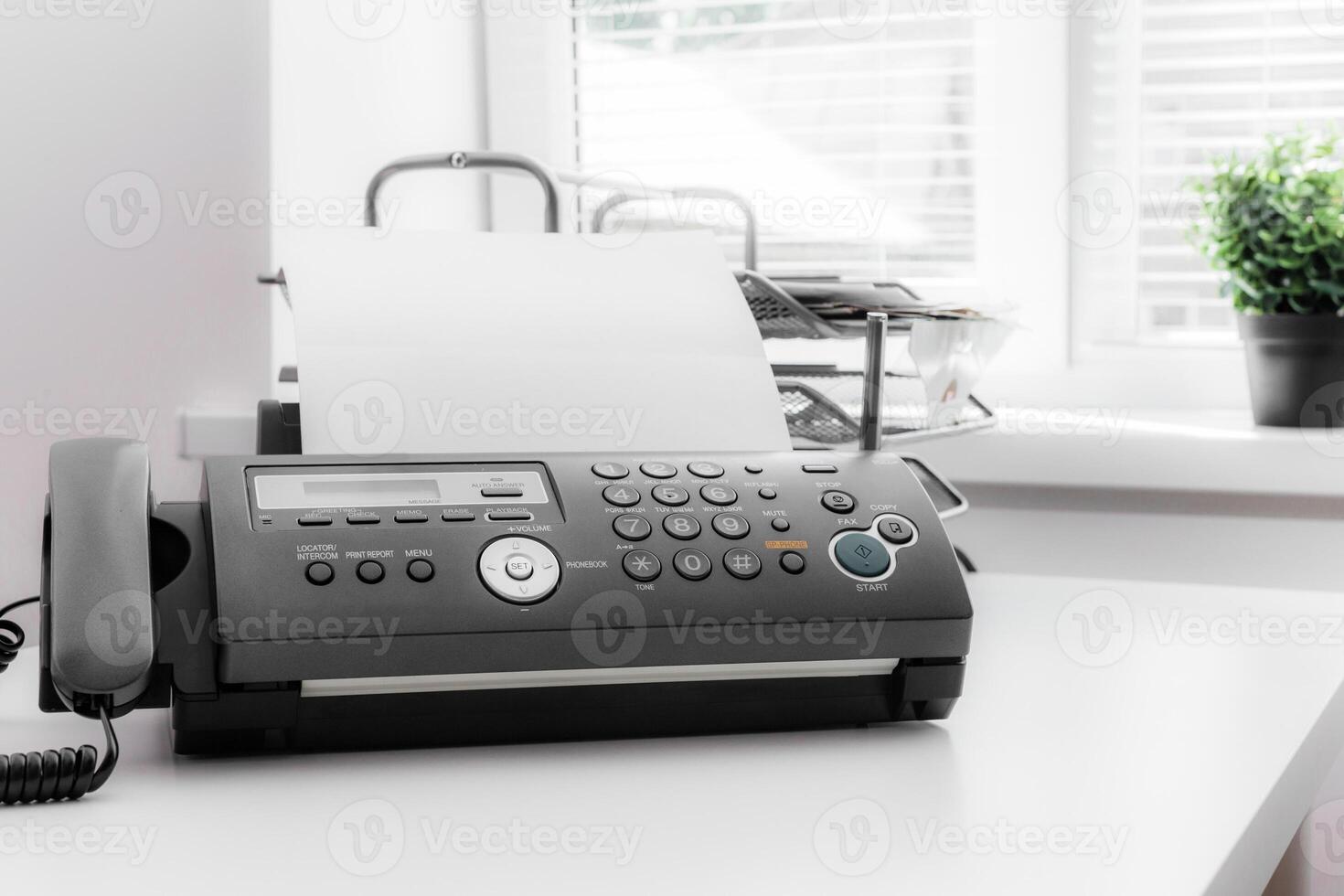 Black fax machine tool close up, business concept photo