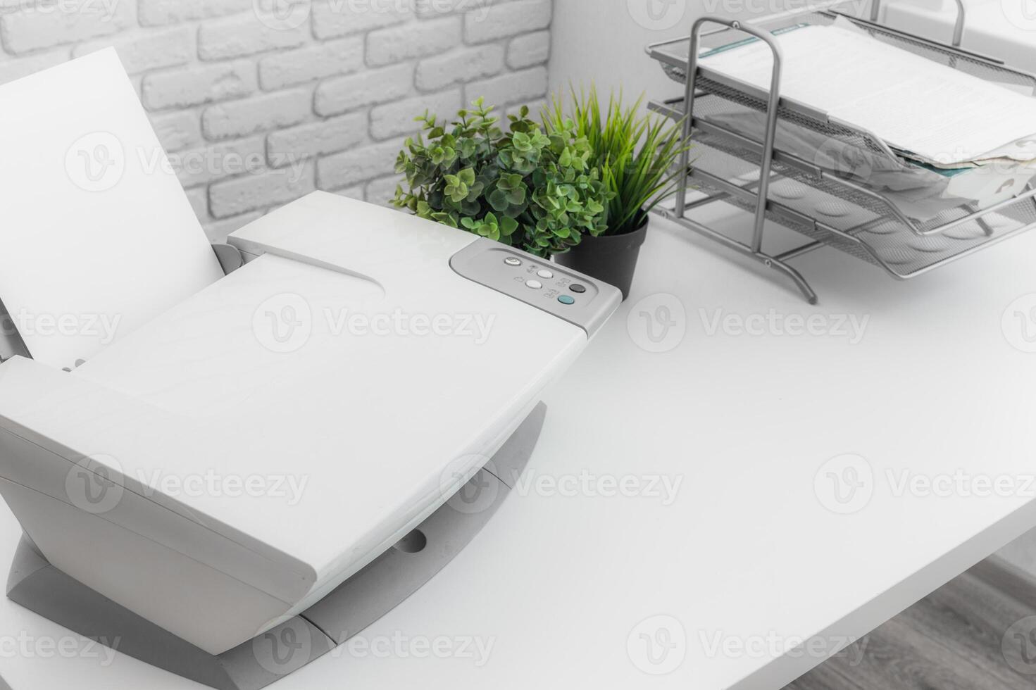 White home printer on white table near the window photo