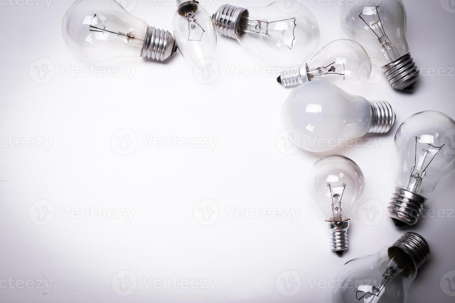Many lightbulbs on white background close up photo