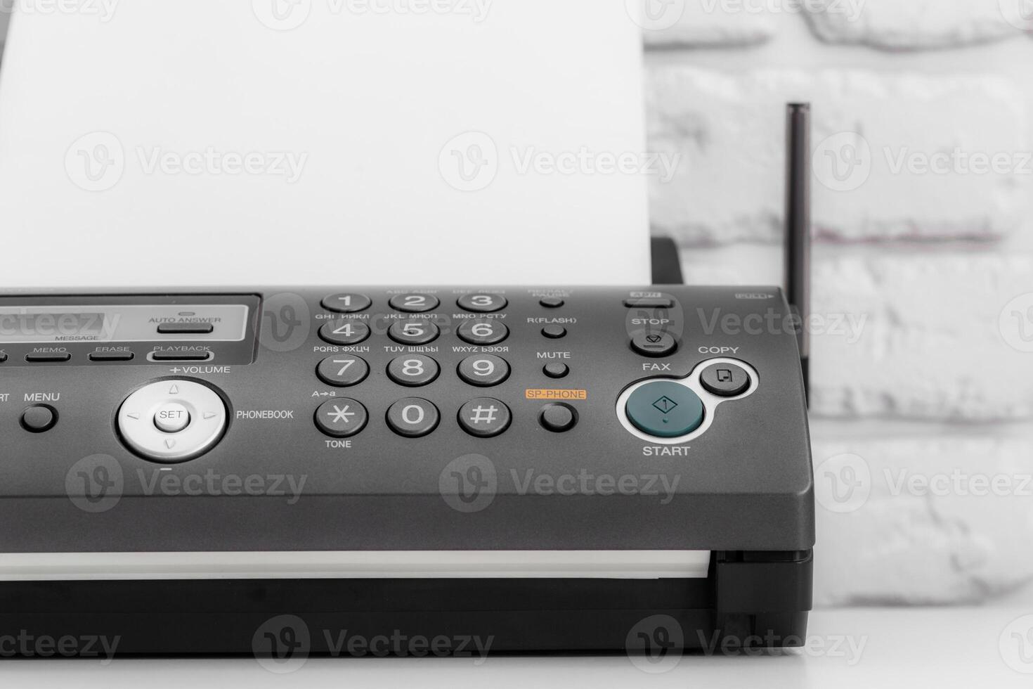 Black fax machine tool close up, business concept photo