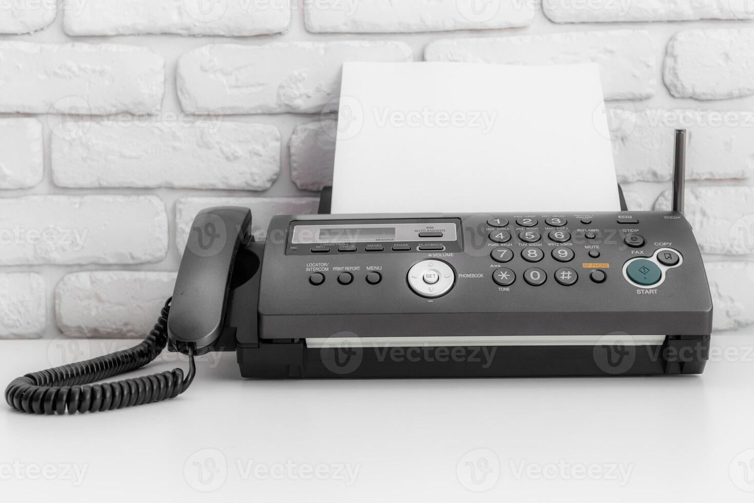 Black fax machine tool close up, business concept photo