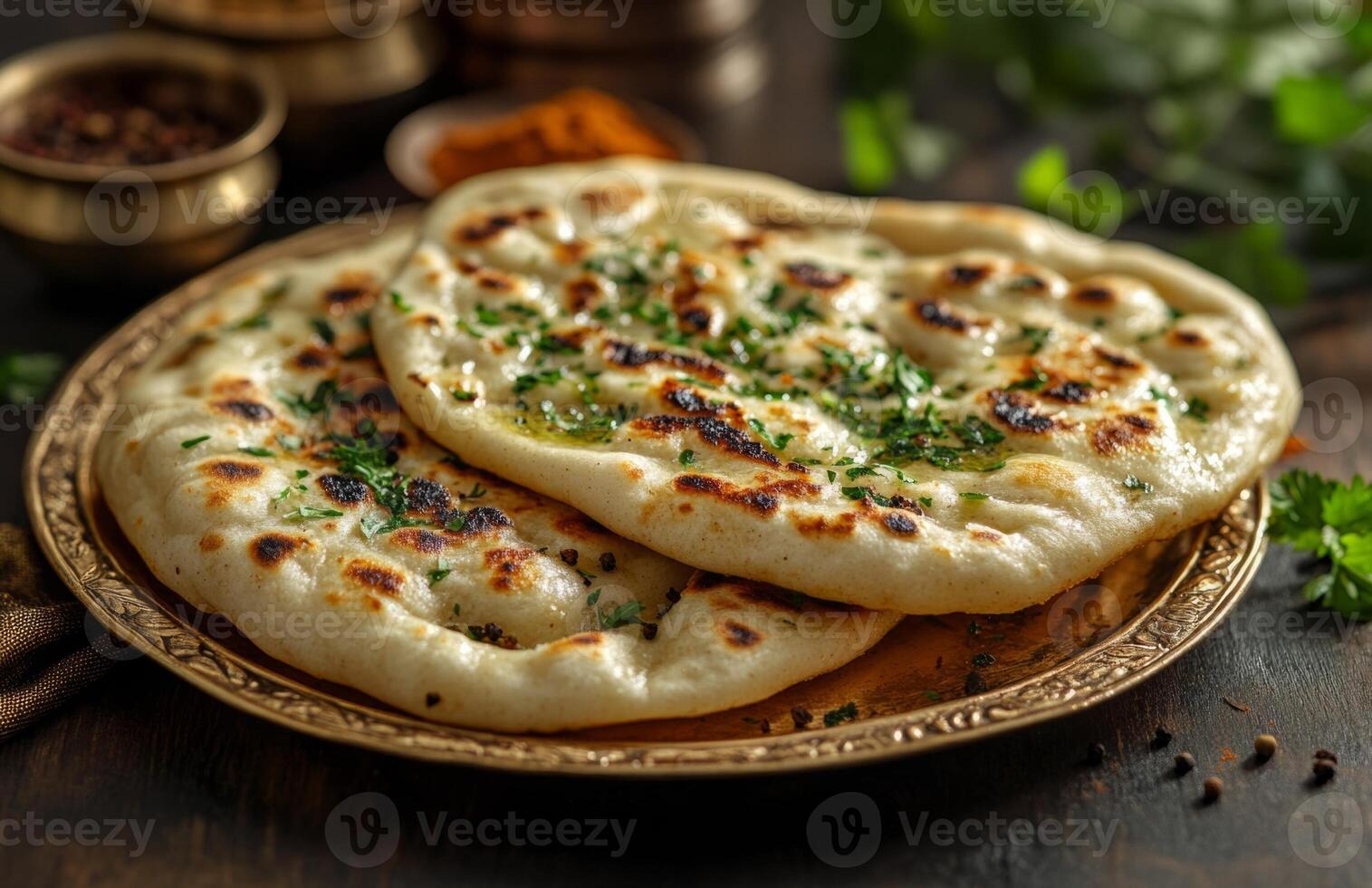 Soft and Fluffy Naan Breads on a Golden Plate with Spices photo