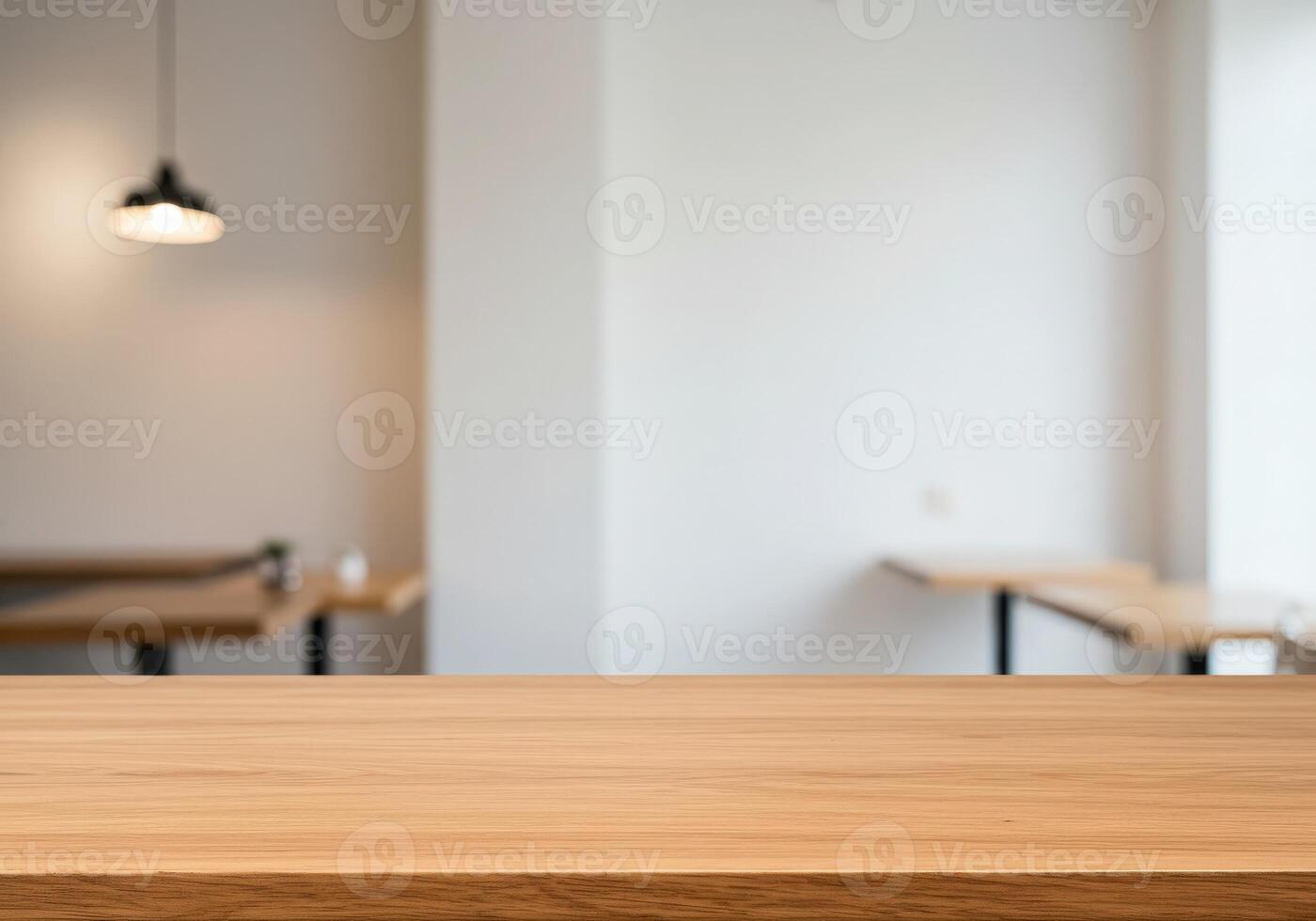 Empty table in a restaurant with white walls photo