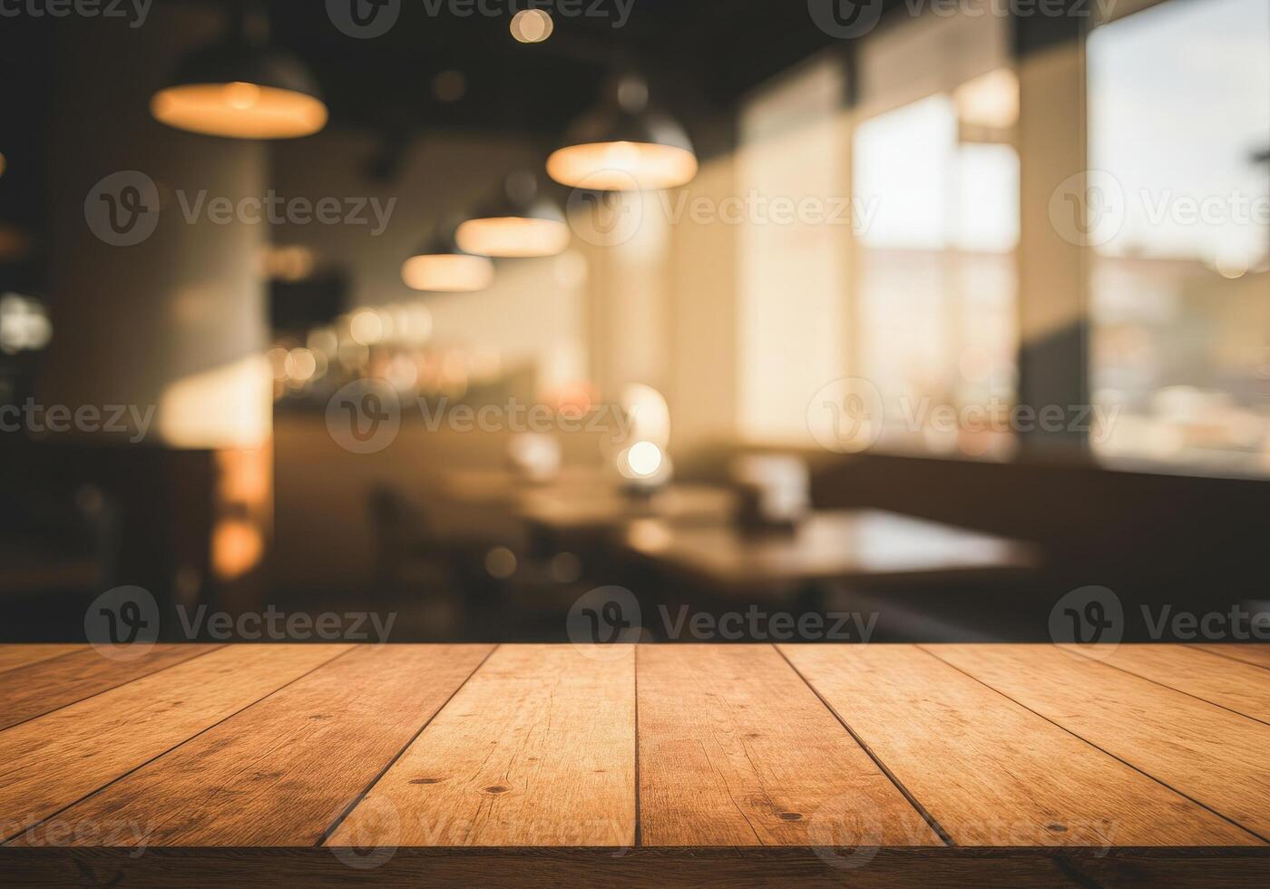 Empty wooden table in restaurant with light in background photo