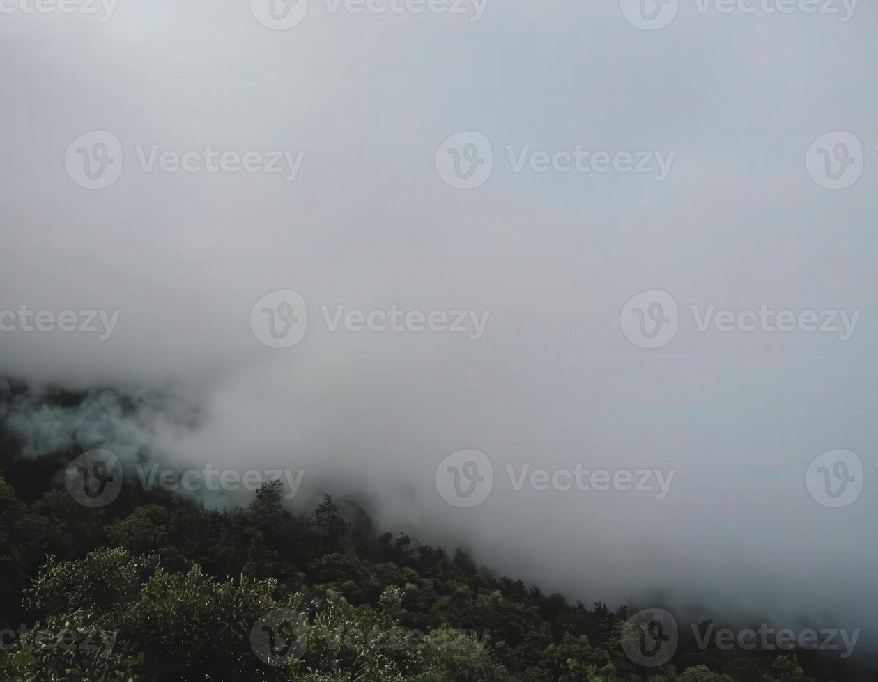 A view of the mountains and clouds from above photo