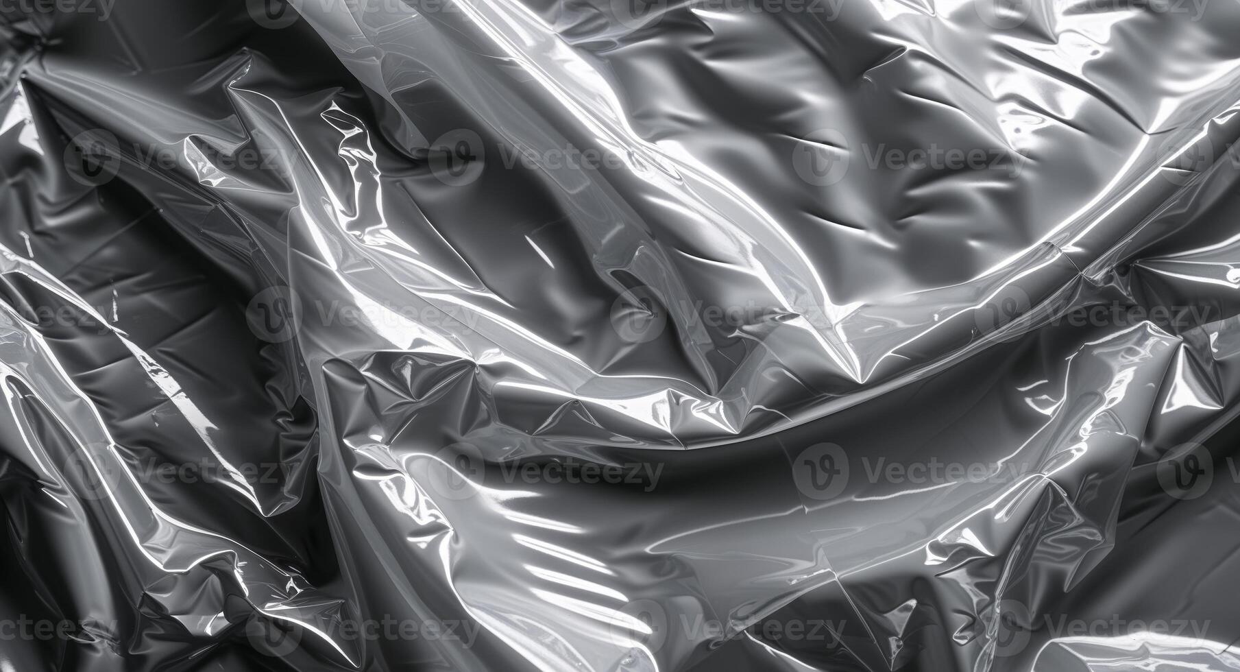 Wrinkled Plastic Wrap Texture on Black Background photo