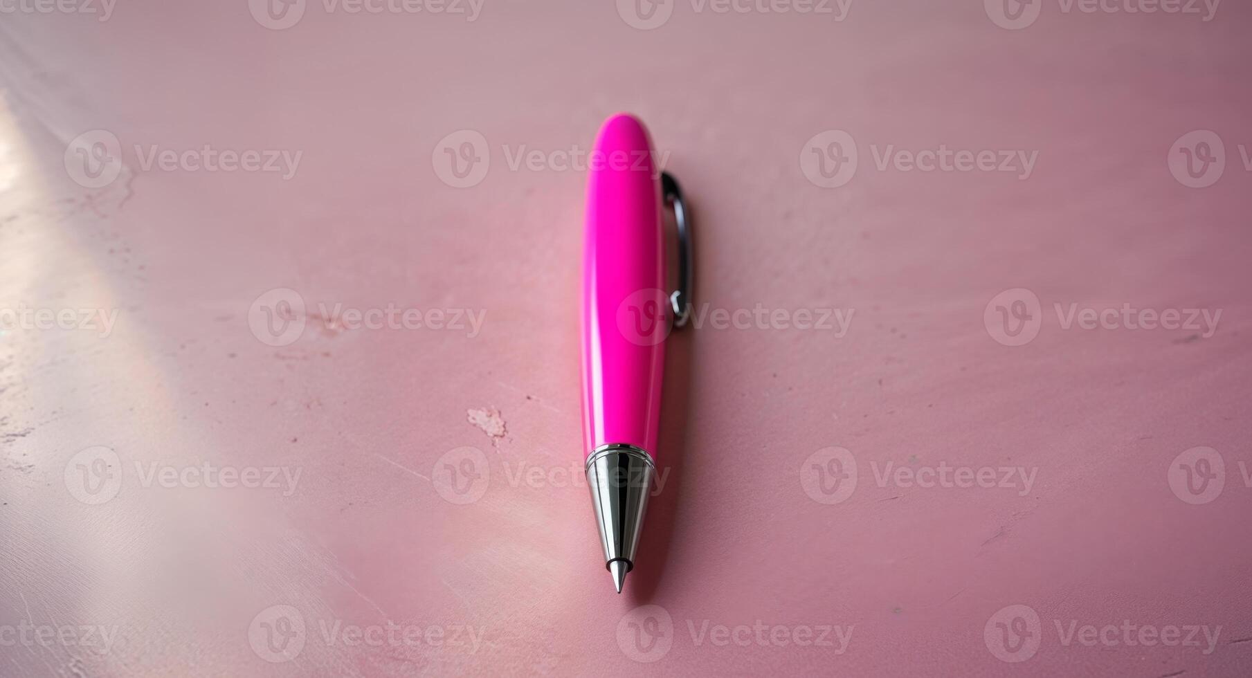 Bright Pink Pen on Smooth Pink Surface for Office Use and Creativity photo