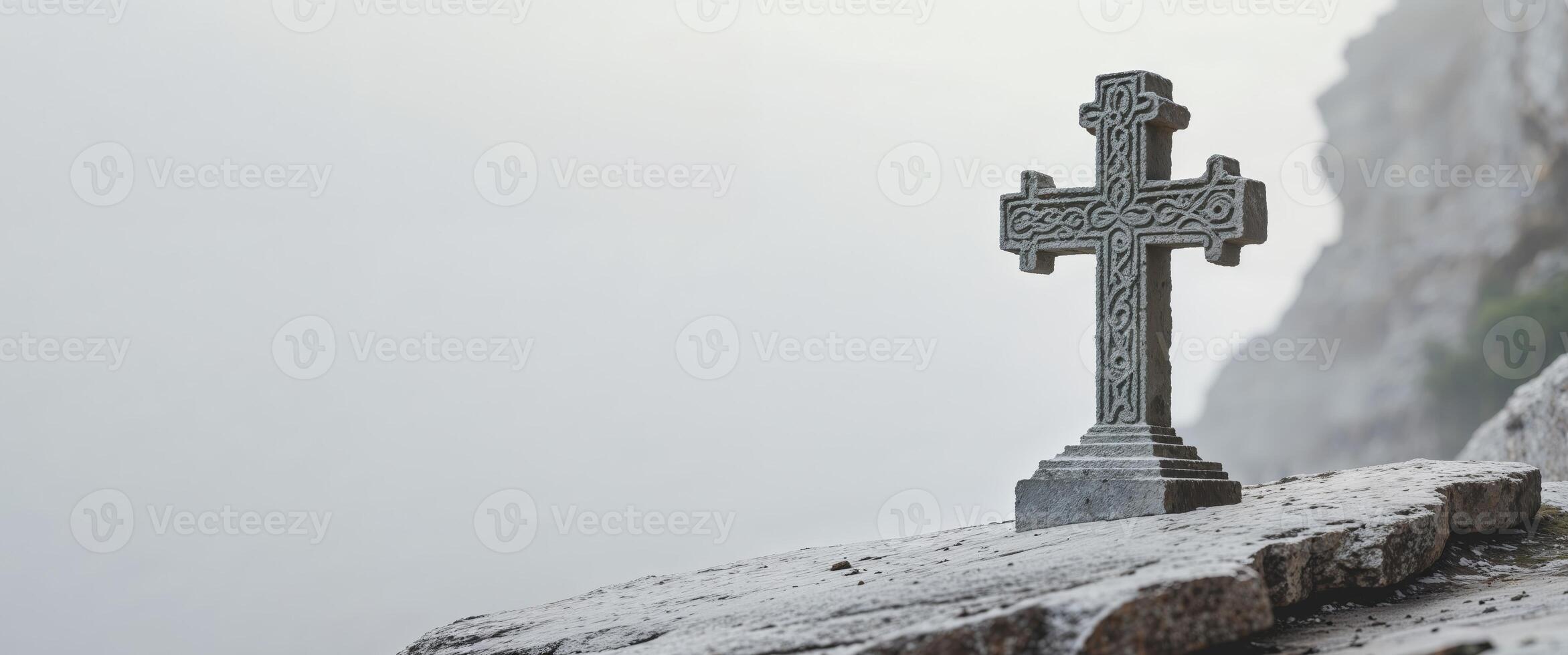 Celtic cross on the edge of a cliff photo