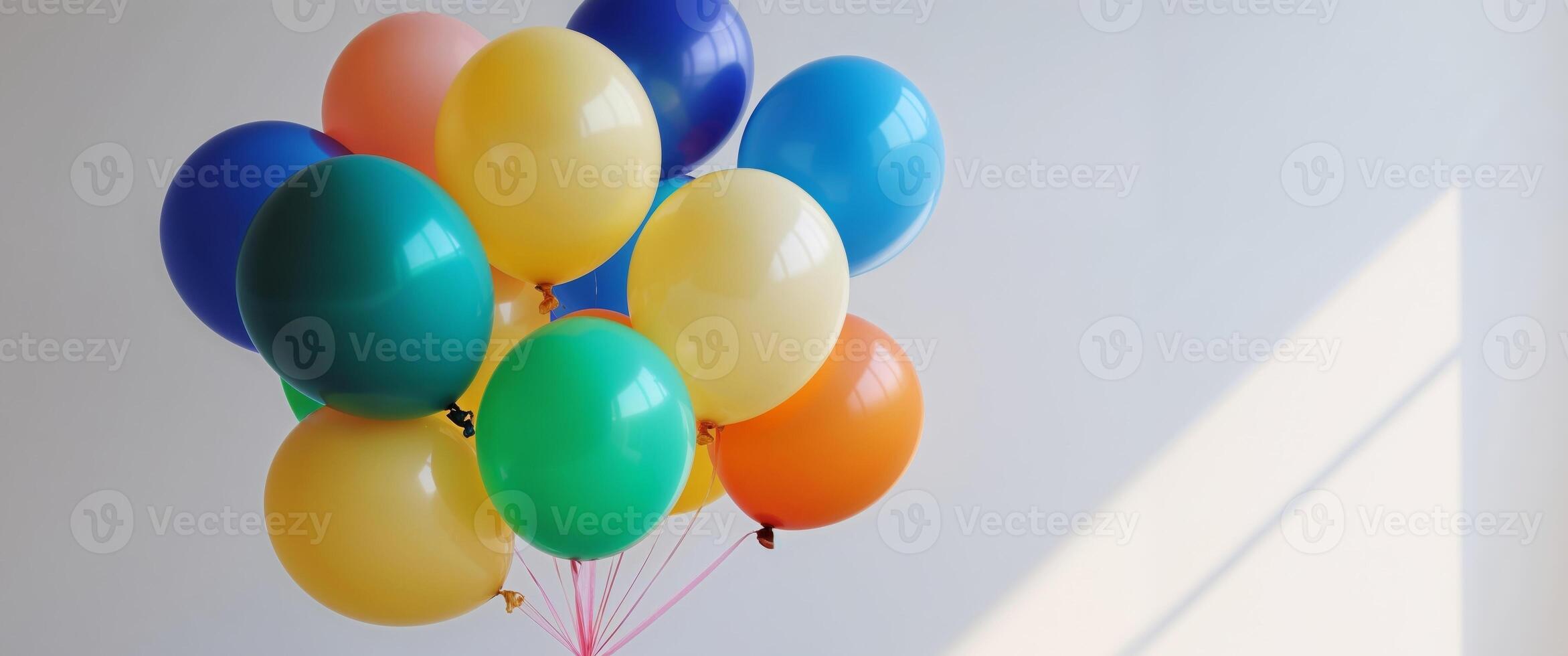 A bunch of balloons are sitting on a table photo