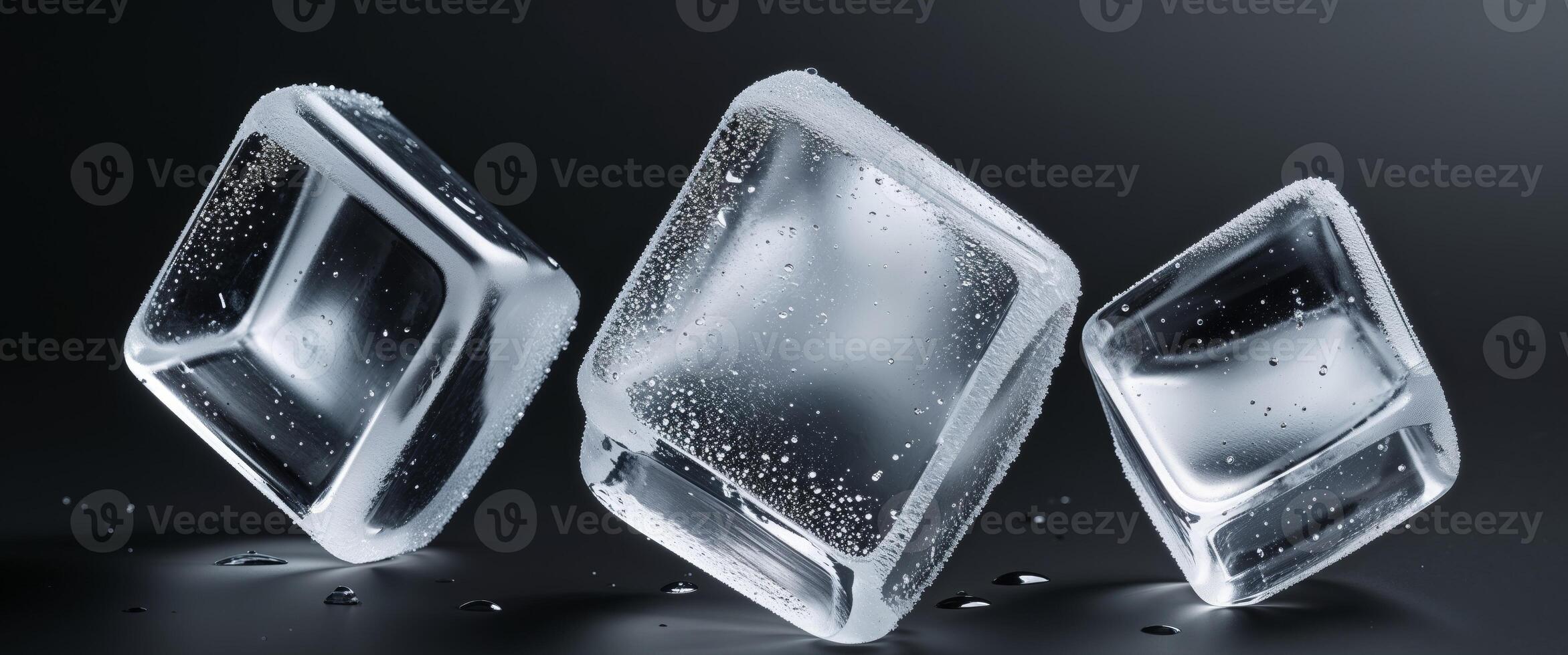Three ice cubes on black background cold refreshing water photo