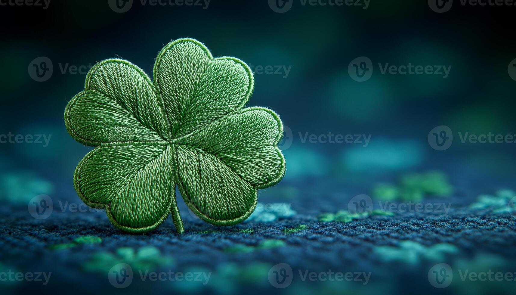 Embroidered green clover on fabric. A green clover design stitched onto a textured fabric, showcasing its vibrant threads against a dark backdrop. photo