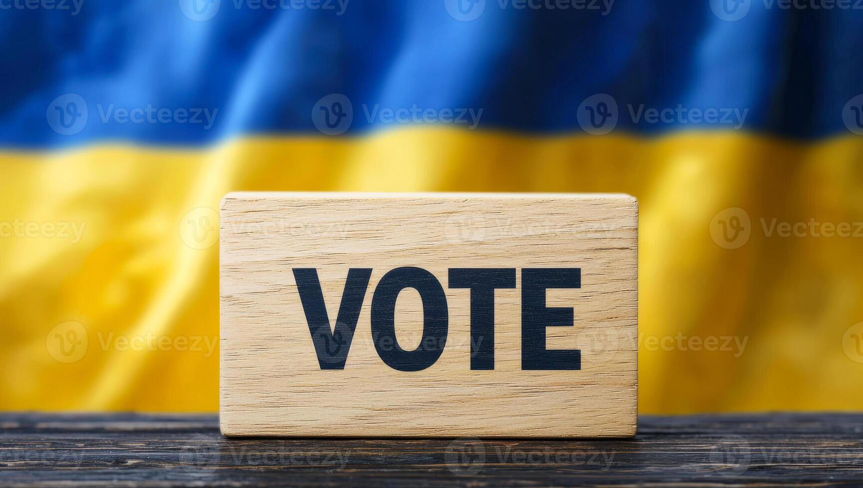 Vote sign in front of Ukrainian flag. A Vote sign sits on a surface with a blue and yellow Ukrainian flag in the background during elections. photo