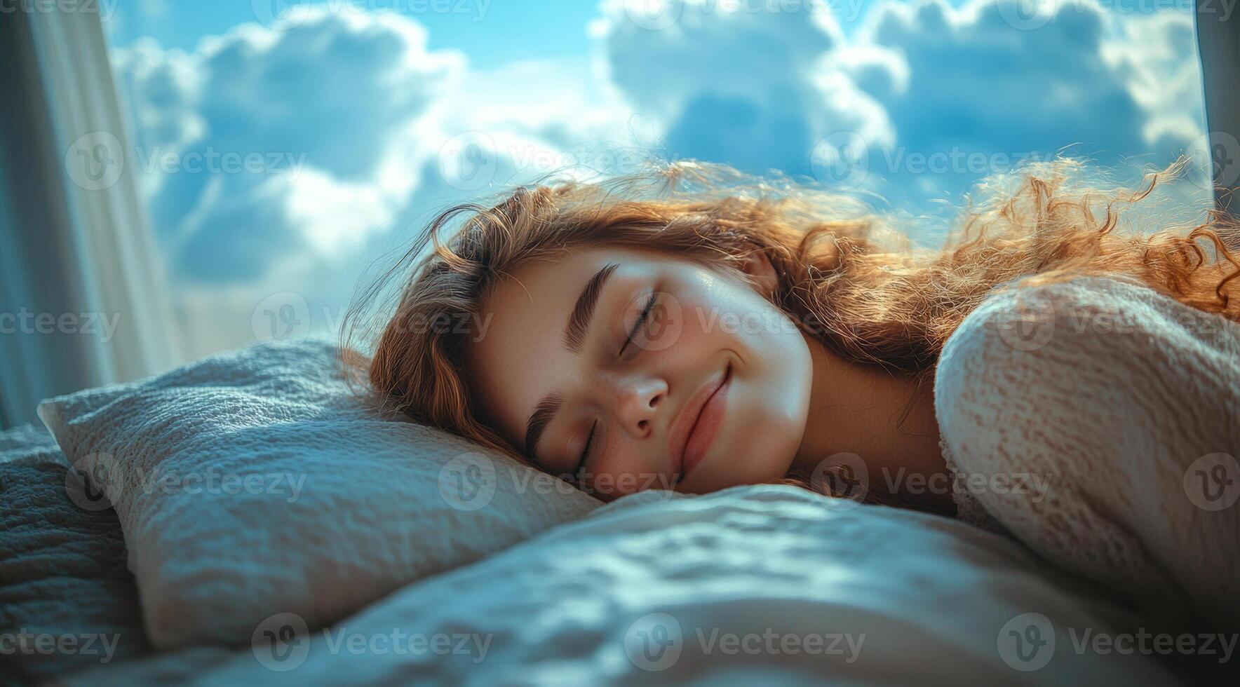A woman is sleeping on a bed with a pillow. She is smiling and she is very happy photo
