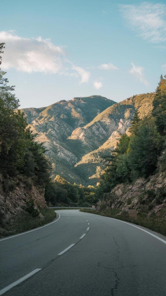 Asphalt road in the mountns by day photo