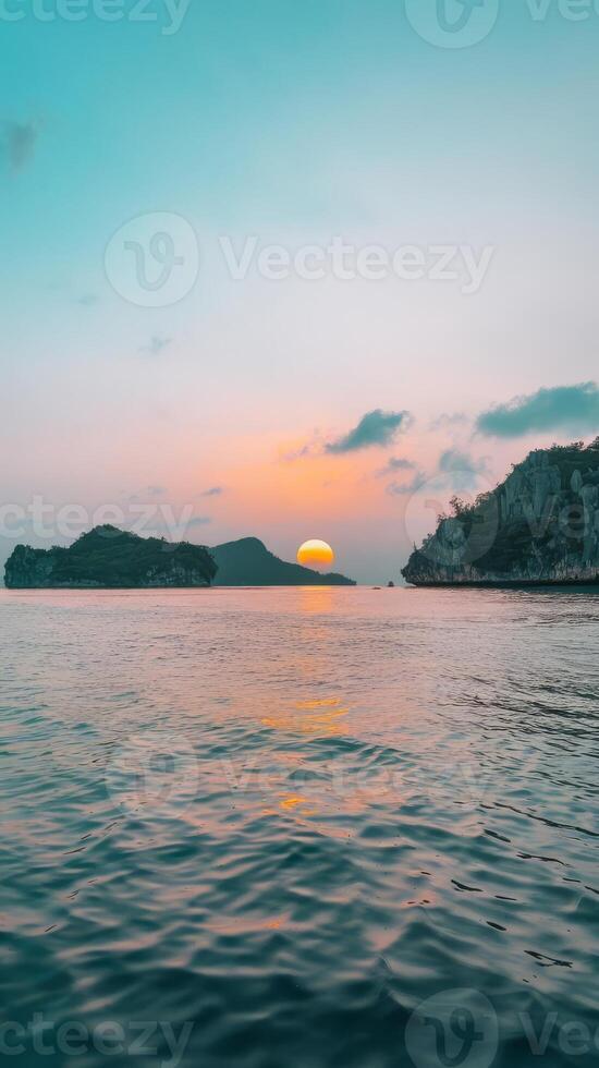 The sun setting over the ocean photo
