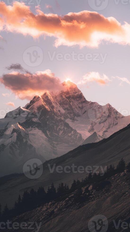 A mountain with a sunset behind it photo