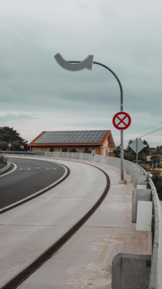 Curve concrete road with curve traffic sign and redwhite prohibited stop sign solar panel energy photo
