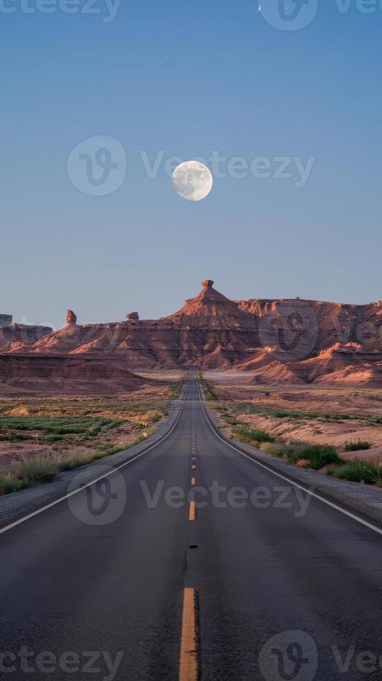 A road with a moon in the sky photo