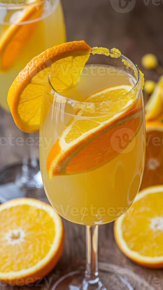 Two glasses of orange juice with slices of orange photo