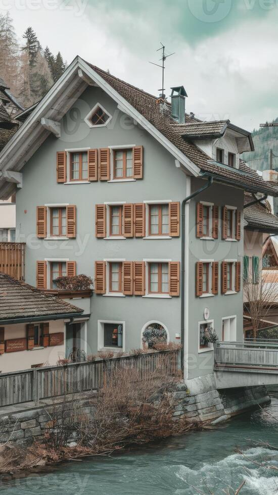 A house with a bridge over a river photo