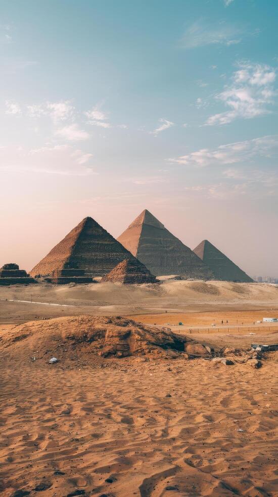 Pyramids of giza in the desert by day photo