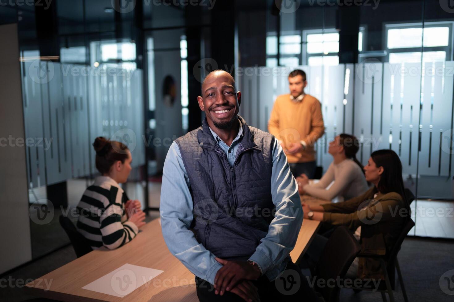 Confident entrepreneur in a startup office, smiling with vision and leadership. Team leader, advisory consultant, and marketing expert at a creative advertising agency workshop photo