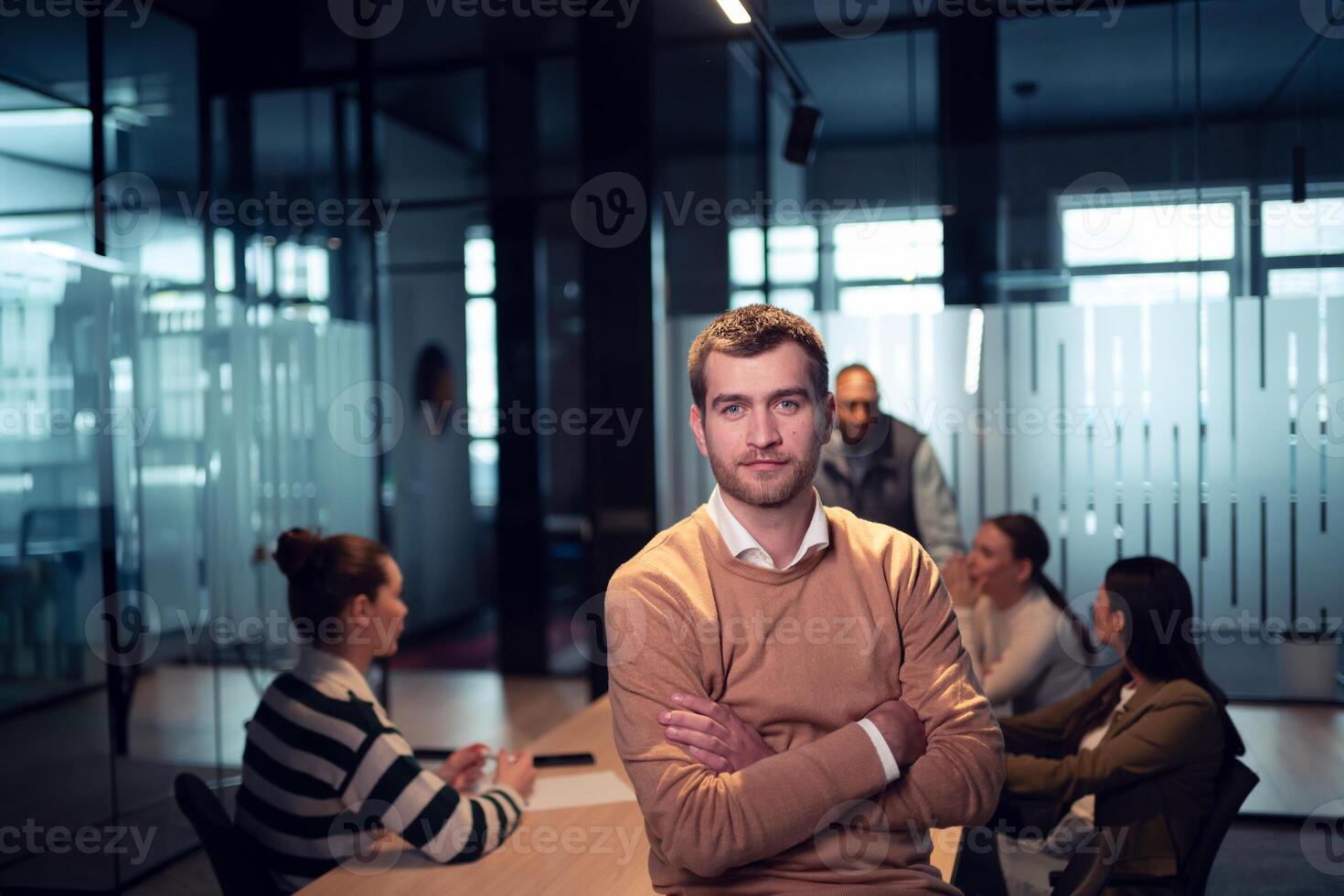 Confident entrepreneur in a startup office, smiling with vision and leadership. Team leader, advisory consultant, and marketing expert at a creative advertising agency workshop photo