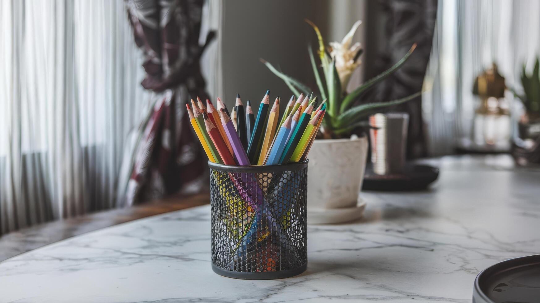 A vase of flowers and a vase of colored pencils on a table photo