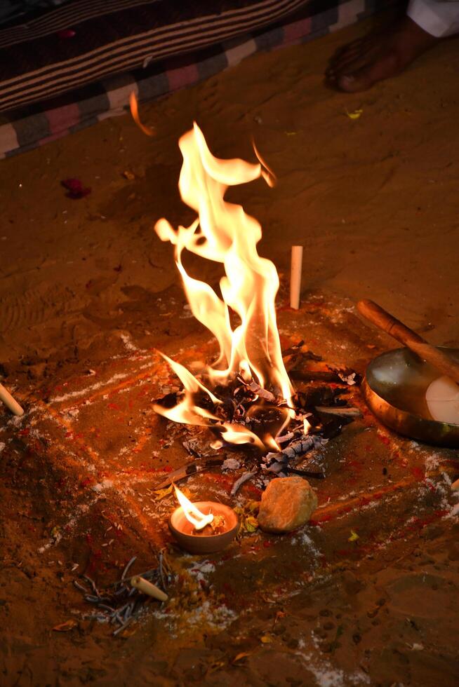 A fire is burning on the ground photo