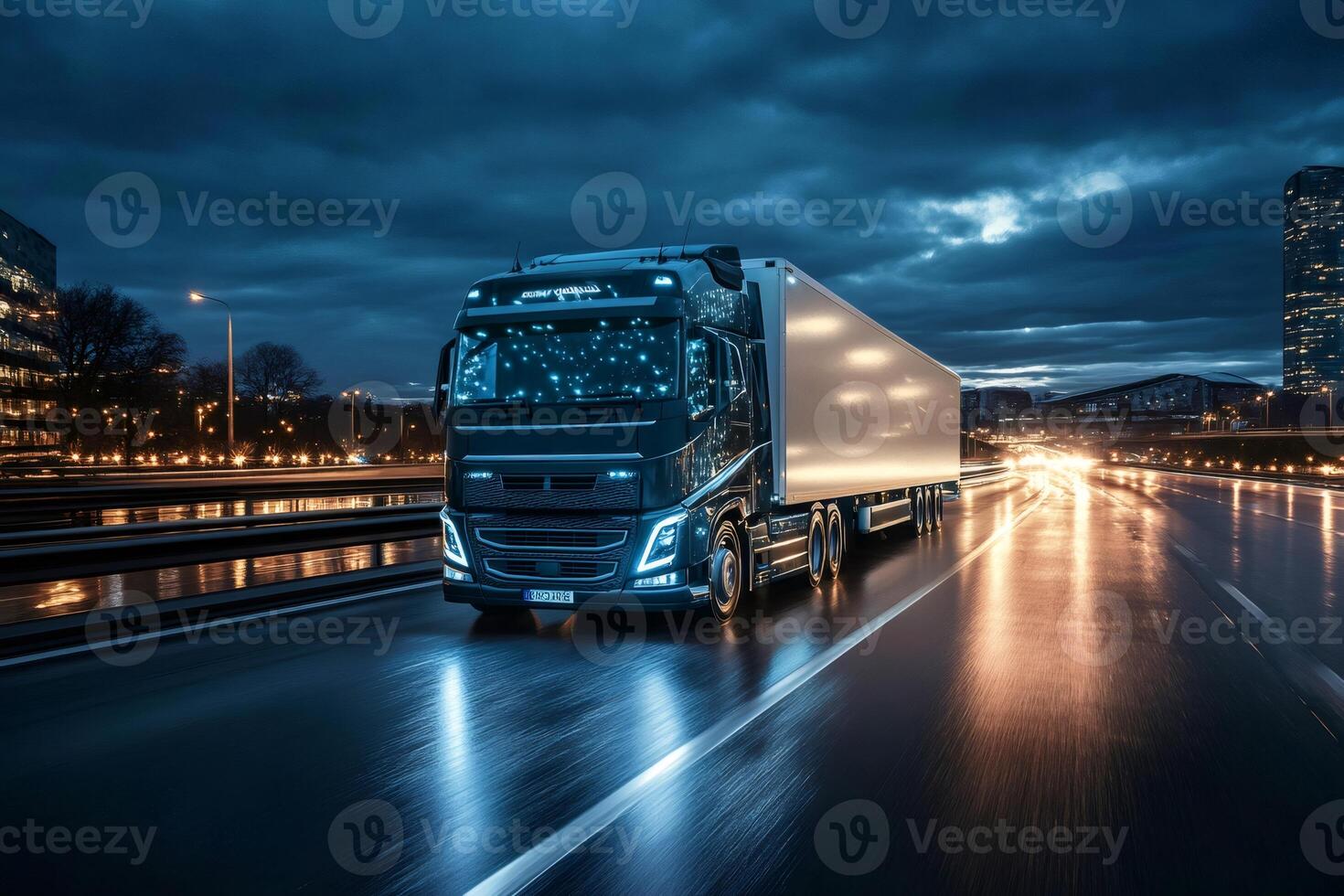 Lorry driving on highway at night with city lights reflecting on wet asphalt photo