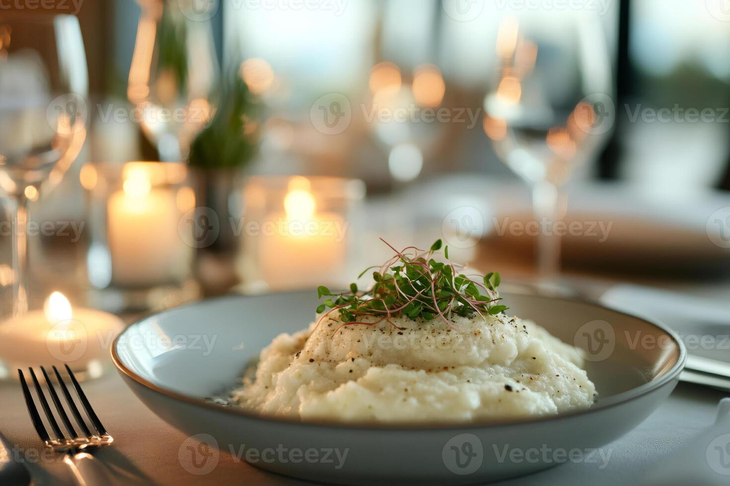 Elegant dining experience with mashed potatoes and candlelight photo