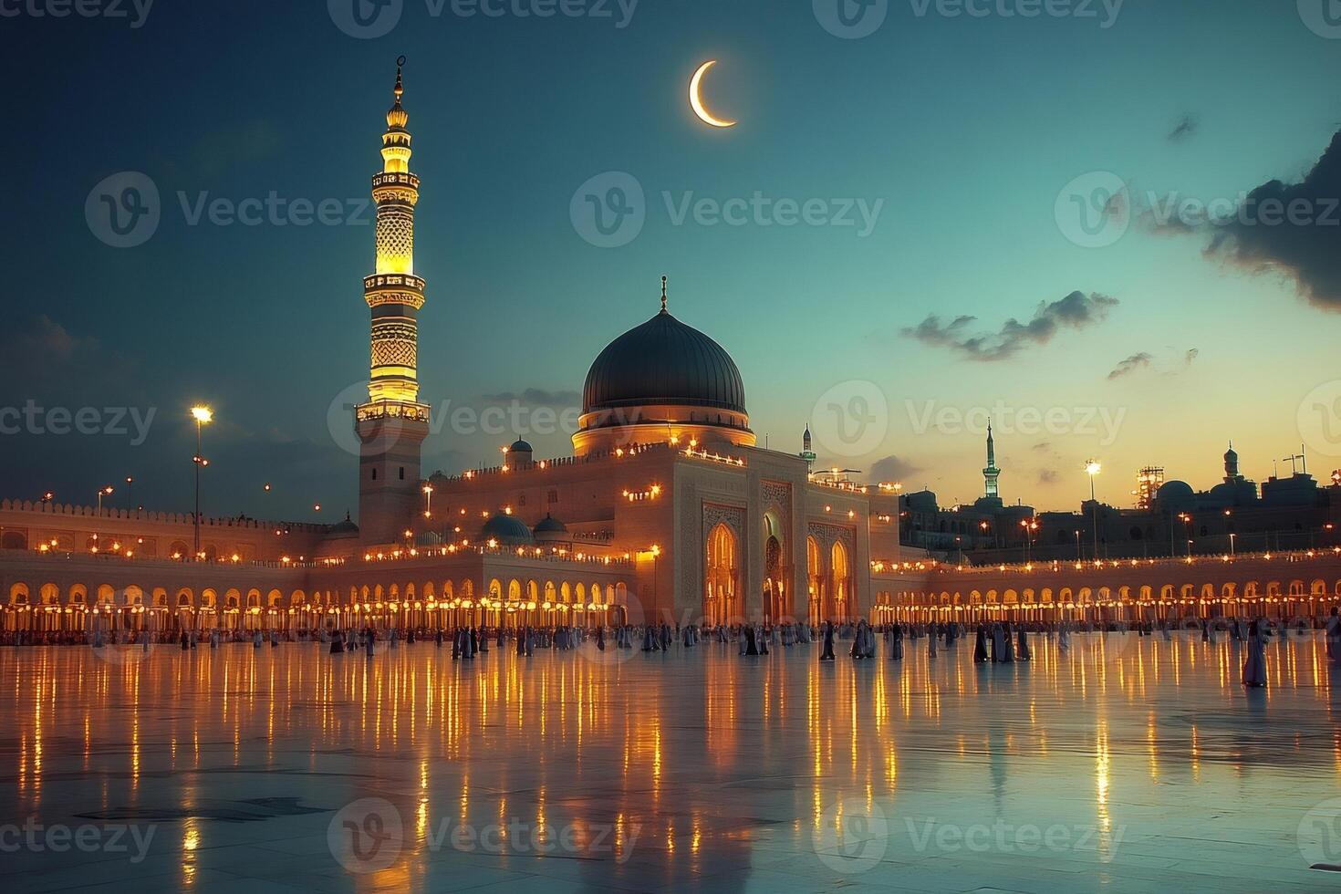 Al masjid an nabawi mosque glowing at sunset with crescent moon in medina, saudi arabia photo