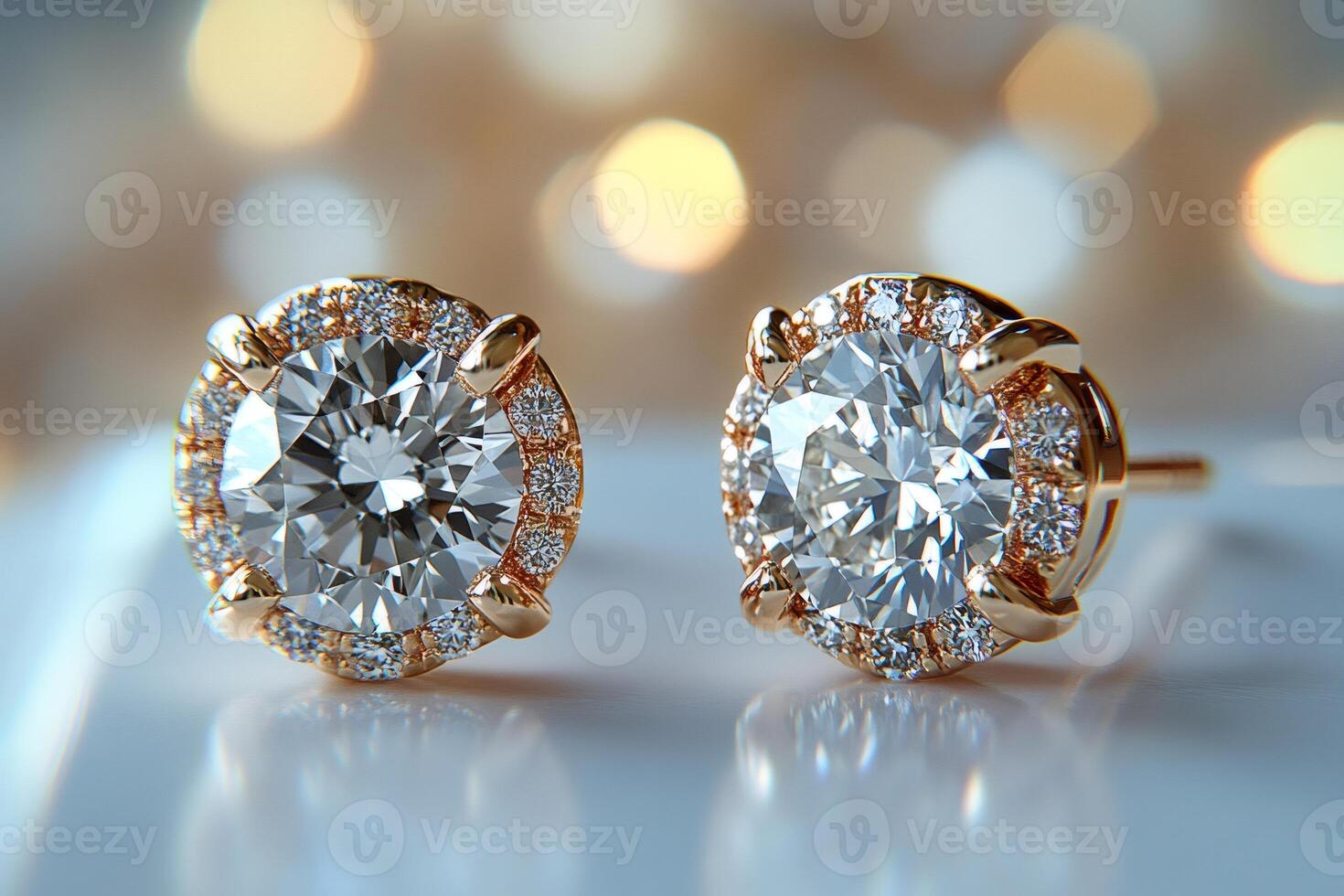 Pair of sparkling diamond earrings reflecting golden light.. photo