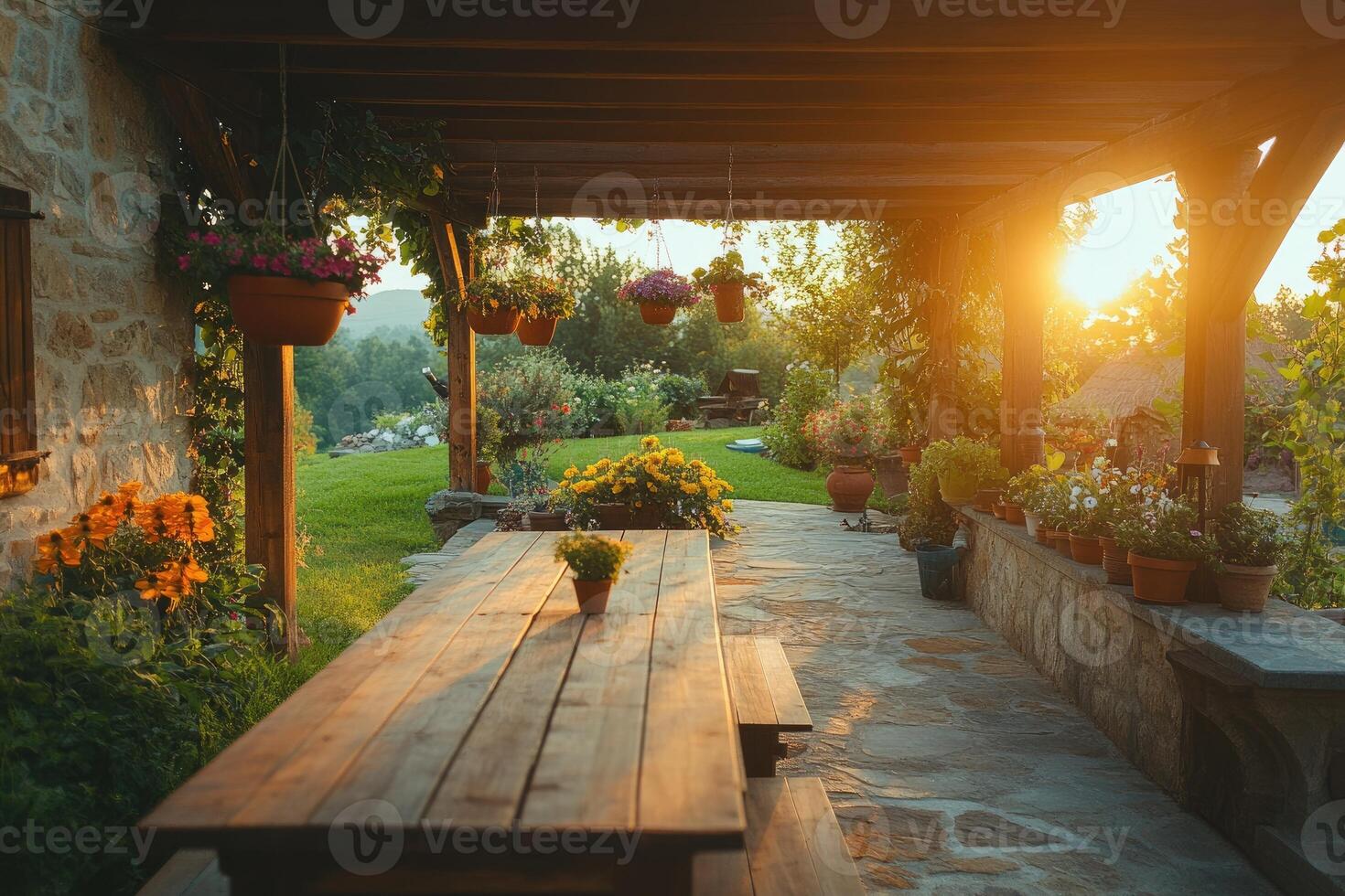 Wooden table illuminating under sunset in cozy pergola garden photo
