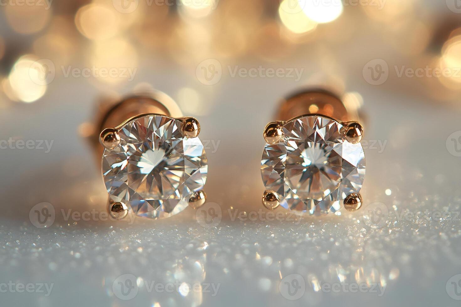 Pair of sparkling diamond earrings on glittering background photo