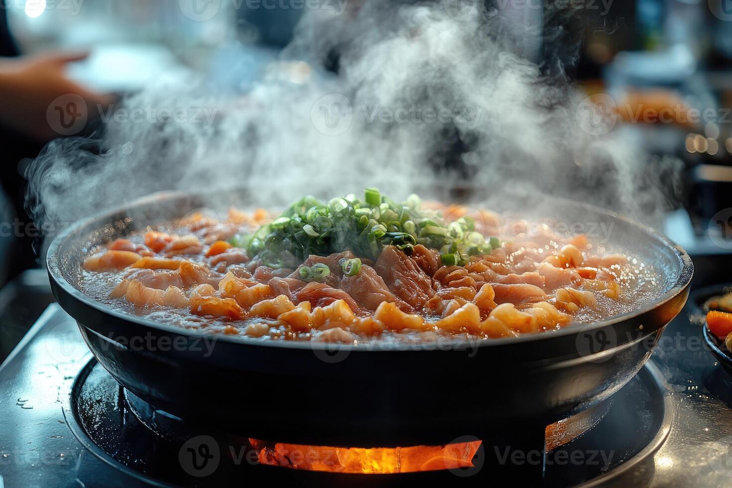 Steaming hot pot dish with fresh ingredients photo