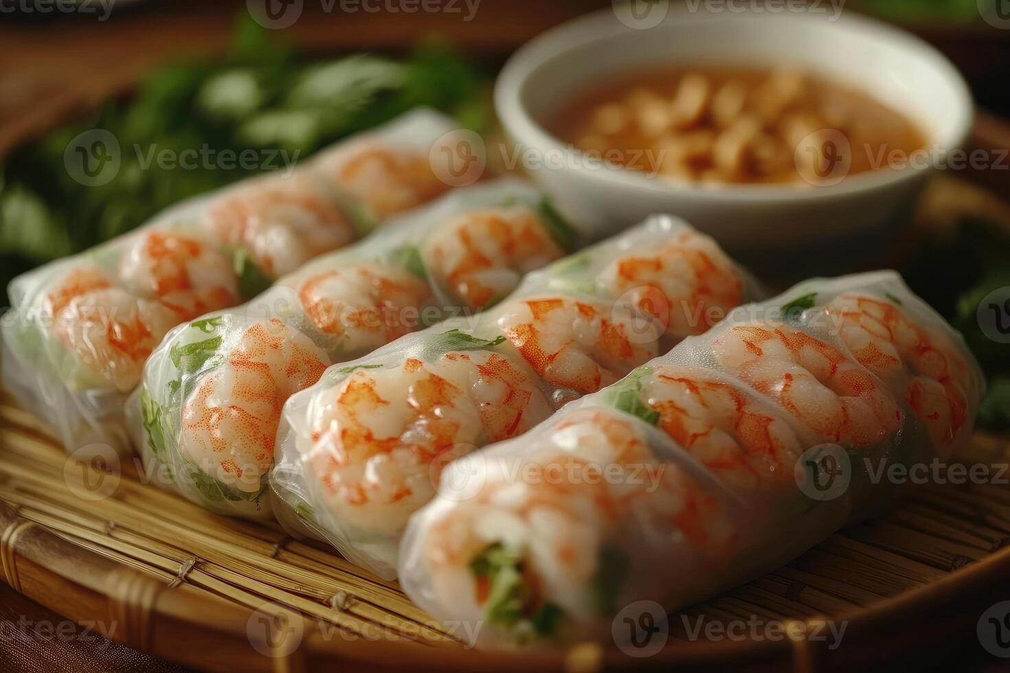 Delicious shrimp summer rolls with peanut sauce on bamboo tray photo