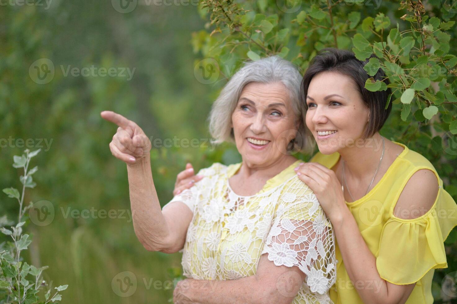 Portrait of an elderly woman with her daughter in the park photo