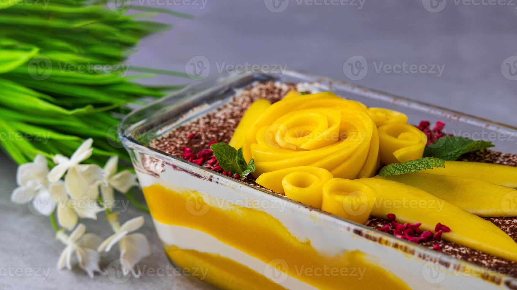 Gourmet mango tiramisu with mascarpone cheese and savoiardi biscuits. delicious dessert photo