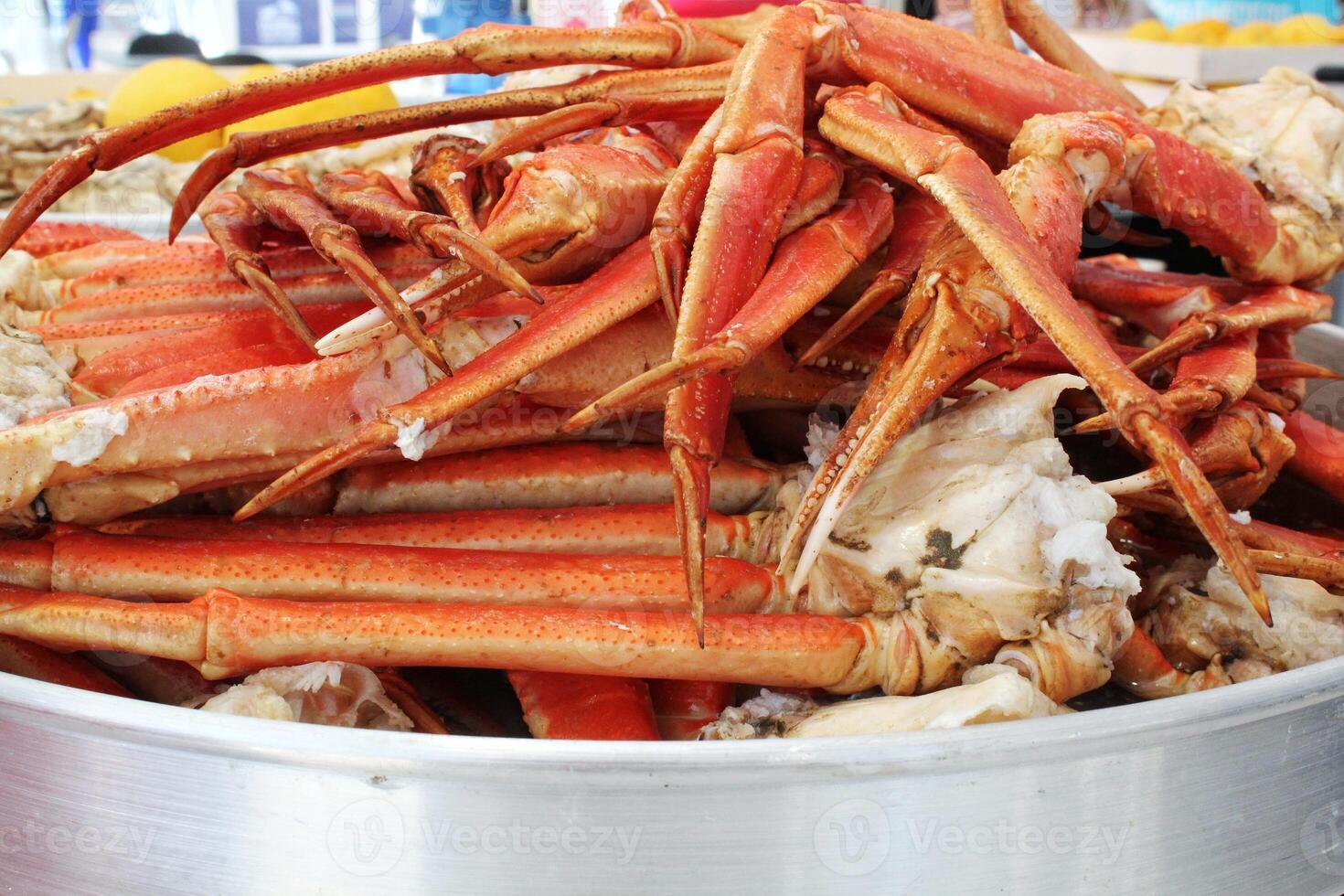 Appetizing cooked crab legs and claws, fresh seafood delicacy. Ready to eat, presented on a platter. Close-up, food photography photo
