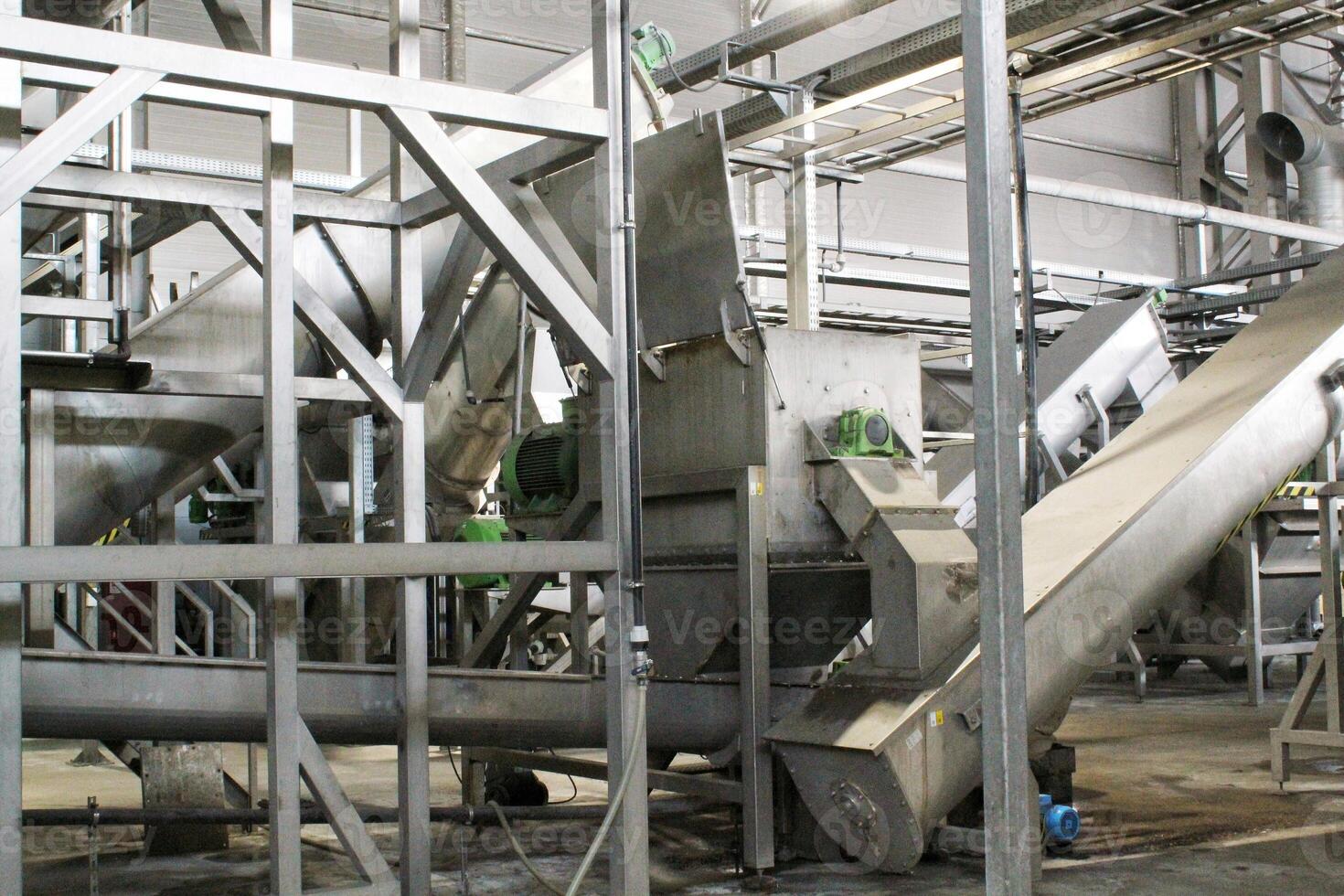 Sustainable brewing steel tanks and pipes in a modern facility for eco-friendly beer production. Industrial brewing equipment and clean brewing technology in a sustainable food processing environment photo