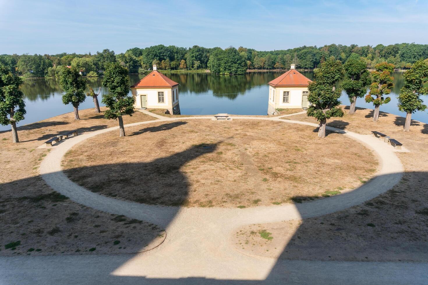 Moritzburg, Germany-august 17, 2022-shadows of the two towers of Moritzburg Castle cast in the garden on a sunny day photo