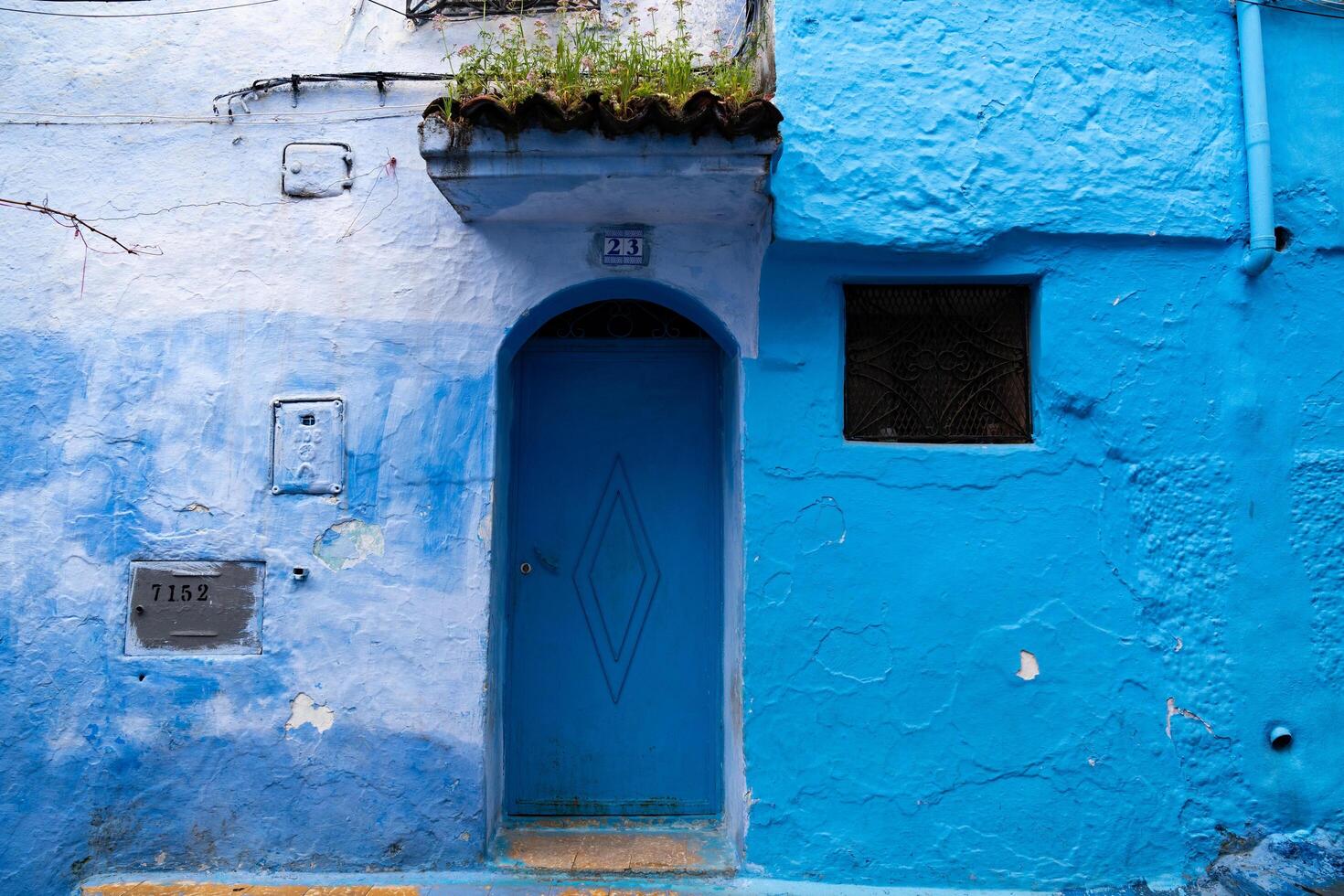 Chefchaouen, Morocco-march 26, 2024-particular of the narrow alleys in Chefchaouen the blue city during the cloudy day photo
