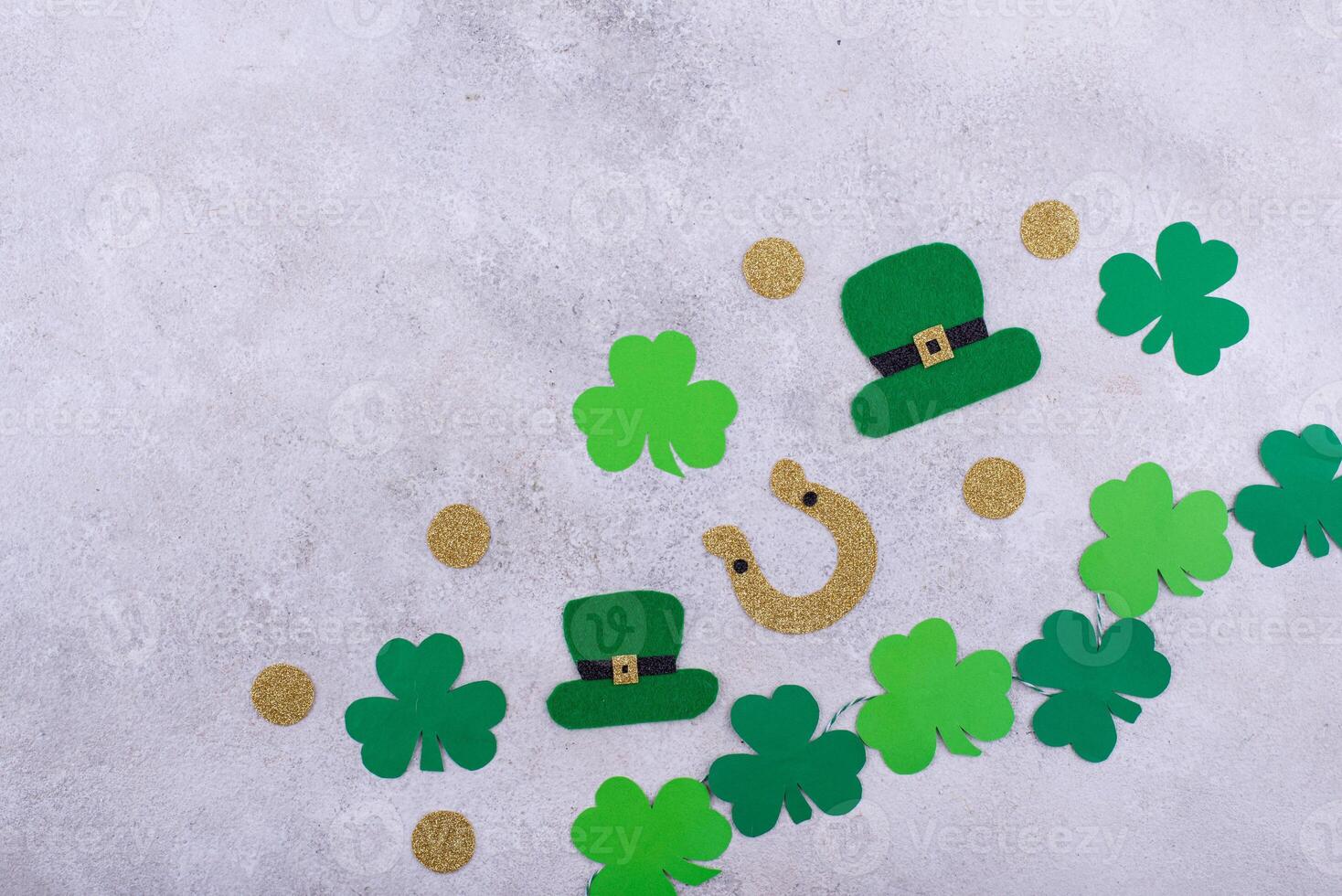 St. Patrick's Day concept with leprechaun hat, gold coins and horseshoe photo