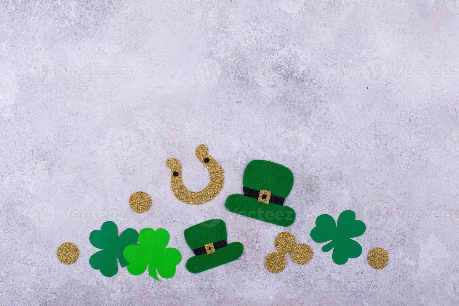 St. Patrick's Day concept with leprechaun hat, gold coins and horseshoe photo
