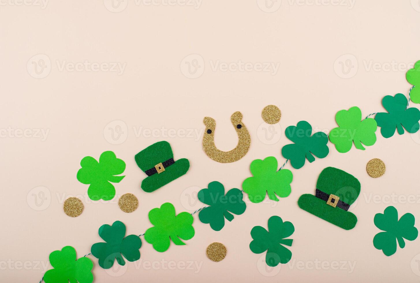 St. Patrick's Day concept with leprechaun hat, gold coins and horseshoe photo