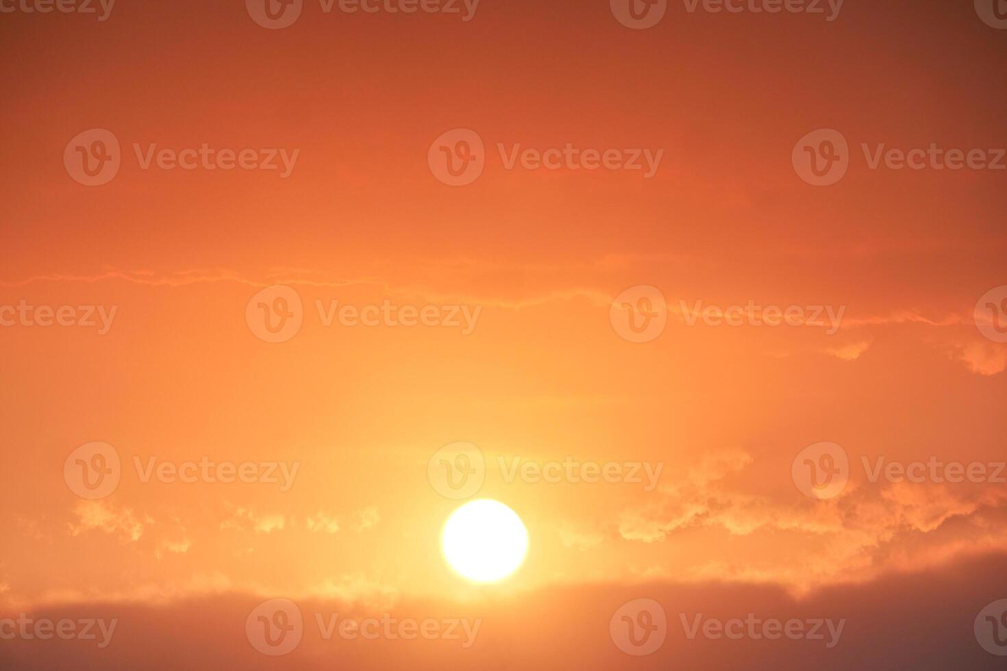 Stunning Sunset with Vibrant Orange and Pink Sky Over Horizon Creating a Serene and Tranquil Atmosphere Perfect for Nature and Landscape Photography photo