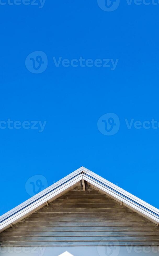 Minimalist Architectural Roof Against Clear Blue Sky Capturing Simplicity and Modern Design photo
