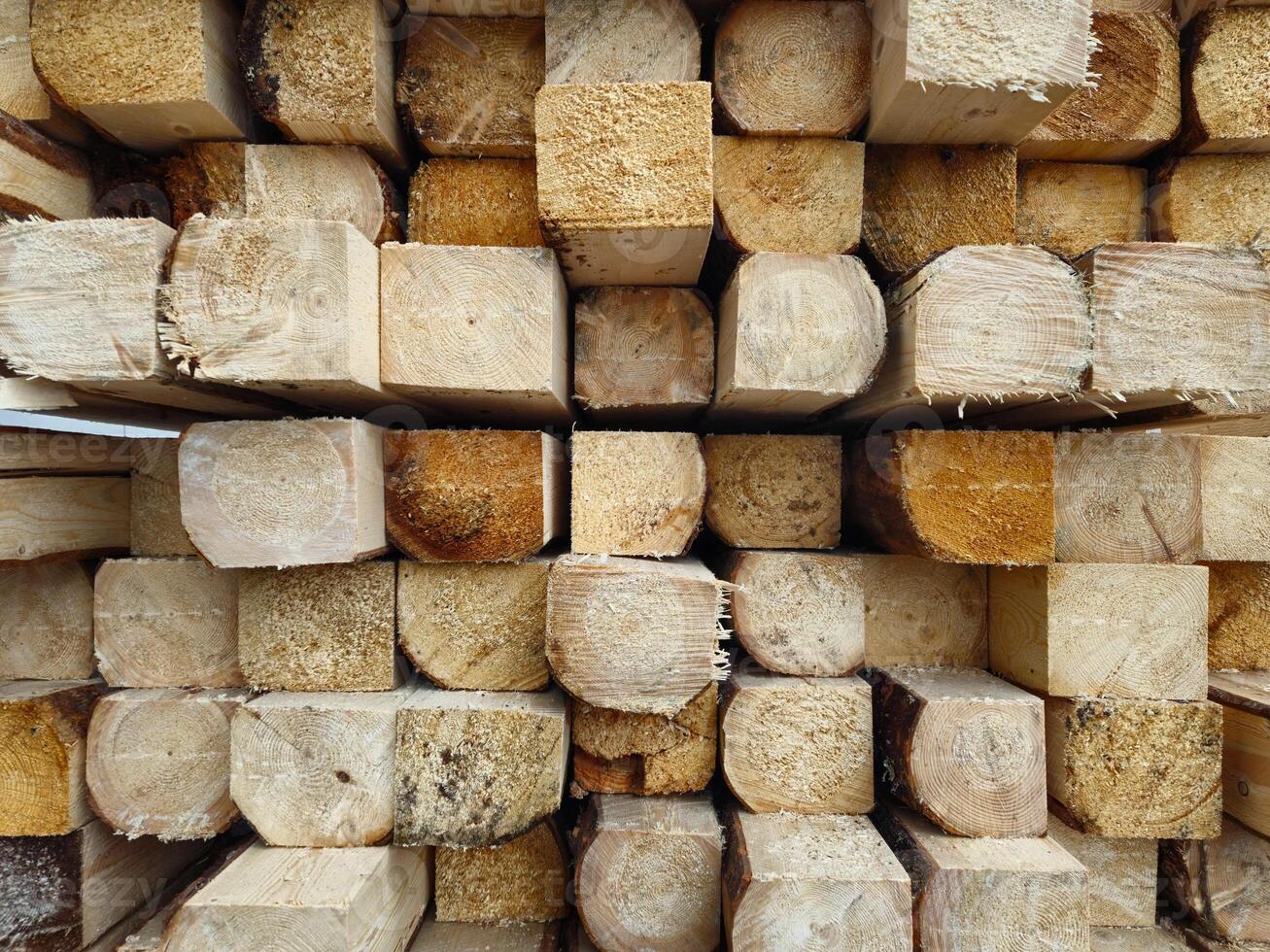 Stack of Wooden Planks in Construction Warehouse for Building Projects photo