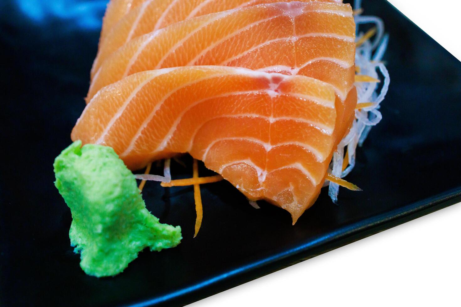 Fresh slice Salmon on the black plate photo